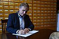 A representative of the Estonian Literary Museum signing the manifesto