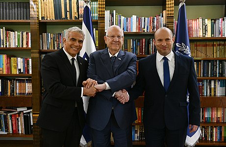 13 June: Naftali Bennett (right) and Yair Lapid (left) replace Benjamin Netanyahu as Israeli Prime minister (president Reuven Rivlin, center)