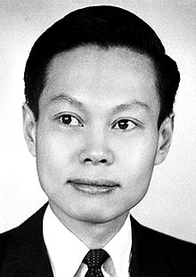 Black-and-white photograph of Yang Chen-Ning at 35 years-old, a young Chinese man with short, dark hair wearing a morning suit.