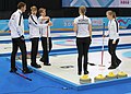 Team Norway discusses the last stone in the last end