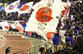 Japanese football fans wave a Rising Sun Flag during a Japan vs. Bosnia and Herzegovina match in January 2008