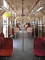 The (modified—with additional handle bars) interior of a Class 83 EMU train.