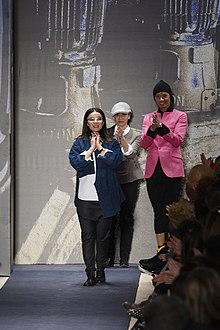 Tia Cibani (left) receives applause at the conclusion of her Ports 1961 Fall/Winter 2010 show at New York Fashion Week, February 2010.