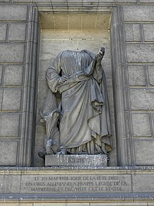 Saint Luke. The statue lost its head to a German shell in World War I.