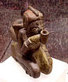 Effigy pipe from Spiro, of a man smoking a pipe