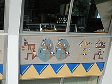 Multicolored mosaic tiles on the first floor, depicting Native Americans