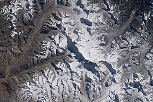 Cho Oyu perspective, taken from International Space Station, glaciers and valleys. China and Nepal border, east is up