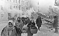 Image 29Residents of Leningrad leave their homes destroyed by German bombing. About 1 million civilians died during the 871-day Siege of Leningrad, mostly from starvation. (from History of the Soviet Union)