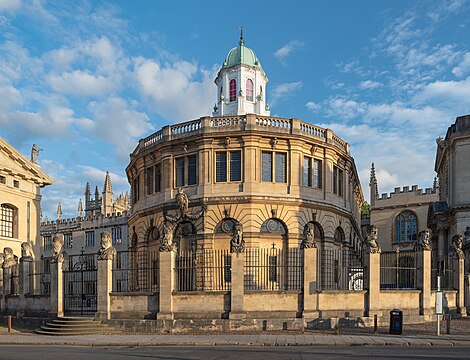 Sheldonian Theatre in Oxford seen from Broad Street, in evening light.