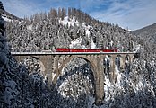 107 votes in Final; A RhB Ge 4/4 II with a push–pull train crosses the Wiesen Viaduct between Wiesen and Filisur, Switzerland. +/− Credit:Kabelleger / David Gubler (http://www.bahnbilder.ch) (License: GFDL / CC BY-SA 3.0)