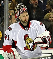 man wearing hockey goaltending equipment