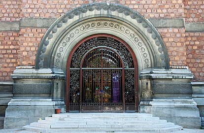 Relief sculpture and ironwork on the entrance of the gallery