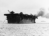 The light aircraft carrier USS Independence (CVL-22) afire aft, soon after the "Able Day" atomic bomb air burst test at Bikini on July 1, 1946