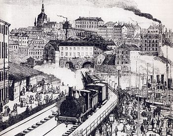 Illustration över Sammanbindningsbanan, 1886. Ett pendeltåg kör norrut på den så kallade getingmidjan vid Riddarholmen, september 2009.