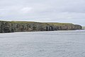 Cliffs and chambered cairn on Helliar Holm.