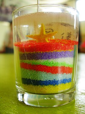 Making decoration with colorful sand