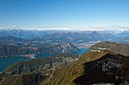  View of the alps of Central Switzerland, Melide, Monte San Salvatore and Lake Lugano from Monte Generoso, Ticino,, Switzerland.