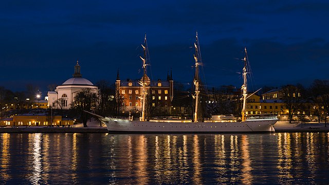 The ship and youth hostel 'af Chapman' on the western shore of Skeppsholmen, Stockholm. Eric Ericsonhallen/Skeppsholmskyrkan and Amiralitetshuset (Admiralty House) behind it.