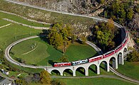 107 votes in Final; Two Rhaetian Railways ABe 4/4 III multiple units with a local train traversing the spiral viaduct near Brusio, Switzerland. +/− Credit:Kabelleger / David Gubler (http://www.bahnbilder.ch) (License: GFDL / CC BY-SA 3.0)