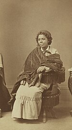 Edmonia Lewis was of Mississauga Ojibwe, African-American and Haitian descent.[72]