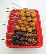 Sate telur puyuh, usus dan hati disajikan di Indonesia