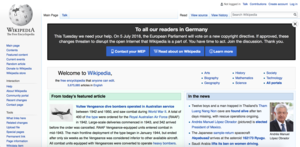 Screenshot of the top-half of the English Wikipedia main page with the banner "To all our readers in Germany" at the top