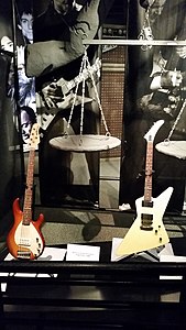 Metallica Scales of Justice Stage Prop (1988), Robert Trujillo's Music Man StingRay 5, James Hetfield's ESP explorer - Rock and Roll Hall of Fame (2014-07-12 15.58.50 by Zurich 99).jpg