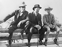 Edward, Prince of Wales, sitting on a corral fence with McLean and George Lane at the EP Ranch in October 1924.