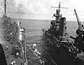 USS Portland passing survivors to USS Fulton