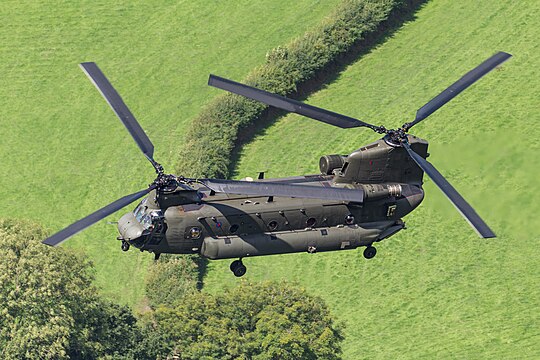 Boeing Chinook HC.6 (reg. ZK558, s/n M7709) of the United Kingdom Royal Air Force (RAF) flying through Corris Corner, Mach Loop, Wales.