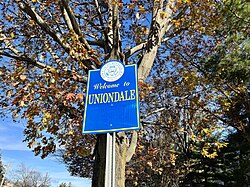 A welcome sign to the hamlet on Oak Street in 2021.