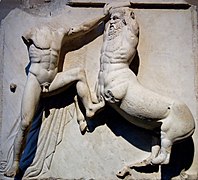 Sculpture of a fight between a man and a centaur.