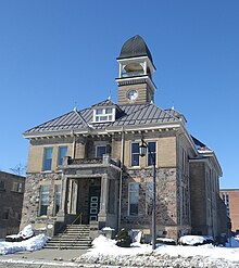 Two-story brick building with a belltower