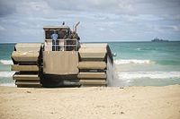 Ultra Heavy-Lift Amphibious Connector lands on the shore after disembarking USS Rushmore with heavy equipment during a Marine Corps Advanced Warfighting Experiment during RIMPAC 2014. The prototype is a ship-to-shore connector and is 50% scale.