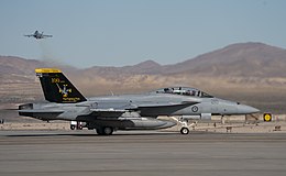 A military jet on an airfield