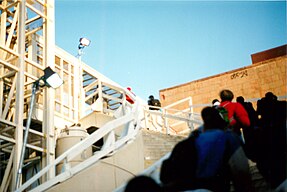 View of the Tribeca Bridge, a pedestrian bridge, with students entering Stuyvesant High School using the bridge, soon after its opening