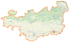 Mapa konturowa powiatu warszawskiego zachodniego, po lewej znajduje się punkt z opisem „Kampinos”