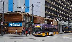 Columbia Sportswear store in downtown Seattle with trolley bus passing (2015).jpg