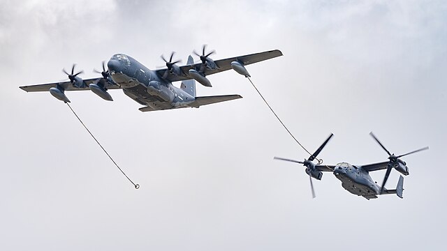 Bell-Boeing CV-22B Osprey of the United States Air Force (reg. 11-0058) following a Lockheed Martin MC-130J Hercules Commando II (reg. 08-6205) mimicking probe-and-drogue refueling at the Royal International Air Tattoo 2023.