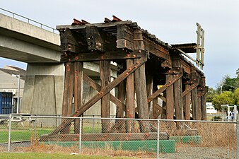 A section of the old railway trestle bridge at South Grafton preserved alongside the new concrete rail bridge.