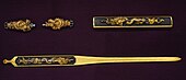 Kōgai (bottom), kozuka (top right), and menuki (top left) made by Gotō Kenjō. Early Edo period. Designated as Special Important Fitting by NBTHK.