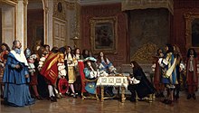 Molière le roi attablé. Le roi se tourne pour parler aux courtisans derrière lui.