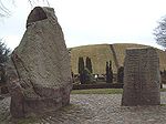 Two standing stones with runic inscriptions and figurative carvings