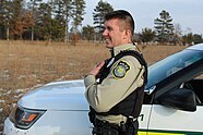 Side profile of a Department of the Army conservation law enforcement officer. Despite ultimately falling-under the Department of Defense “umbrella” this officer wears a “Department of the Army Police” shoulder patch clearly visible in the picture. His uniform mimics that of other game wardens and park rangers within the United States.