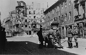 Stroop Collection, not in the report. Cannon on Zamenhofa Street shooting North at resistance in Gęsia 20 building