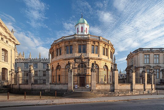 Sheldonian Theatre in Oxford seen from Broad Street, in evening light.