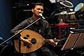 2010, Malaysia. Musician playing gambus Hadhramaut.