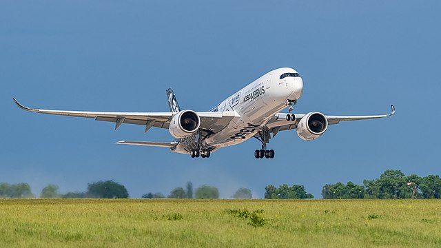 Airbus A350-941 (reg. F-WWCF, MSN 002) in Airbus promotional CFRP livery at ILA Berlin Air Show 2016. Takeoff from runway 25L on Berlin Brandenburg Airport (BER).