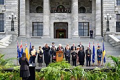 A group of state officials gathered outside Parliament House accompanied by heralds