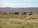 "Shape, shine, shadow" make these 'camouflaged' military vehicles easily visible.